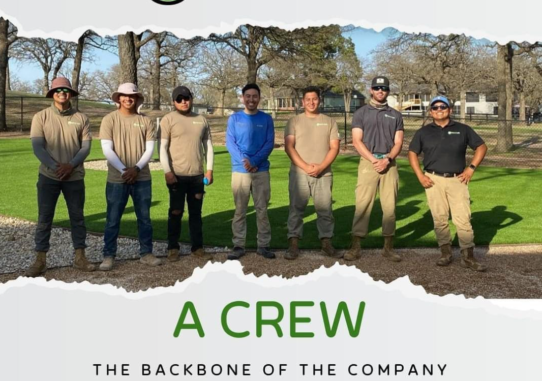 Diverse landscaping crew standing proudly on a green field with text overlay 'A CREW - The Backbone of the Company', symbolizing teamwork and dedication in an outdoor setting.